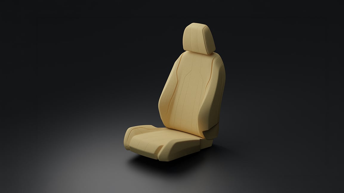 a beige car seat on a grey background